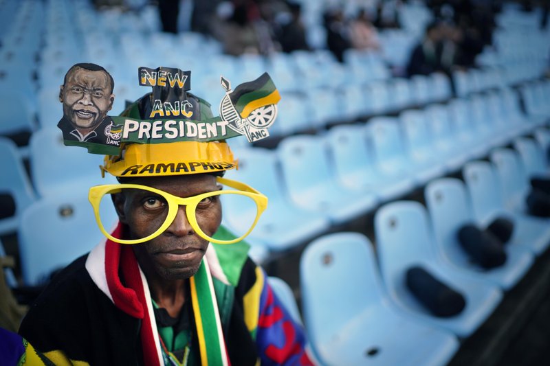African National Congress party (ANC) supporters gather for the swearing-in ceremony for South African President Cyril Ramaphosa at Loftus Versfeld stadium in Pretoria, South Africa, Saturday, May 25, 2019. Ramaphosa has vowed to crack down on the corruption that contributed to the ruling ANC' s weakest election showing in a quarter-century. (AP Photo/Jerome Delay)