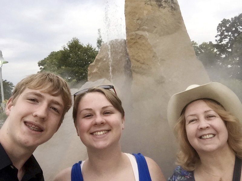 This October 2018 photo made available by Virginia Black, right, shows her niece, Alexandra Black, and her son, Anthony Hauguel, in Lafayette, Ind. Alexandra died in a fatal lion mauling at an animal sanctuary in North Carolina in Dec. 2018. Now, her aunt is urging lawmakers to strengthen regulations on animal facilities in the state. (Alexandra Black via AP)