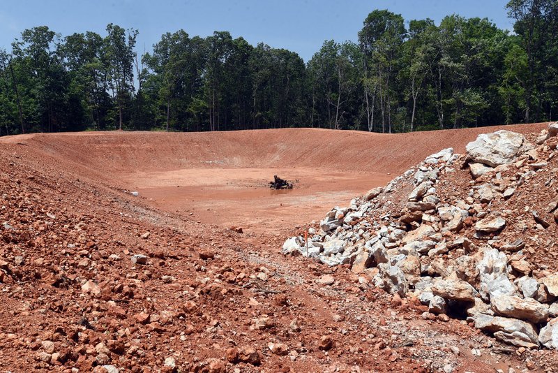NWA Democrat-Gazette/FLIP PUTTHOFF A new berm is under construciton Wednesday at the Benton County Sheriff's Office shooting range. The range when refurbished will double in length to 100 yards and allow deputies to tackle more real-life scenarios, said Maj. Kenneth Paul. It should open in about a month.