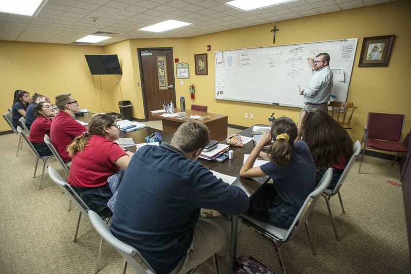 NWA Democrat-Gazette/SPENCER TIREY Matt Green teaches sophomores Algebra 2 on May 16 at Ozark Catholic Academy in Tontitown. Northwest Arkansa' first Catholic high school, is wrapping up its first year.