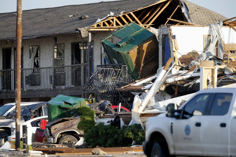 Part of a roof is exposed at the American Budget Value Inn after a tornado moved through the area in El Reno, Okla., Sunday, May 26, 2019. The deadly tornado leveled a motel and tore through the mobile home park near Oklahoma City overnight. (Bryan Terry/The Oklahoman via AP)