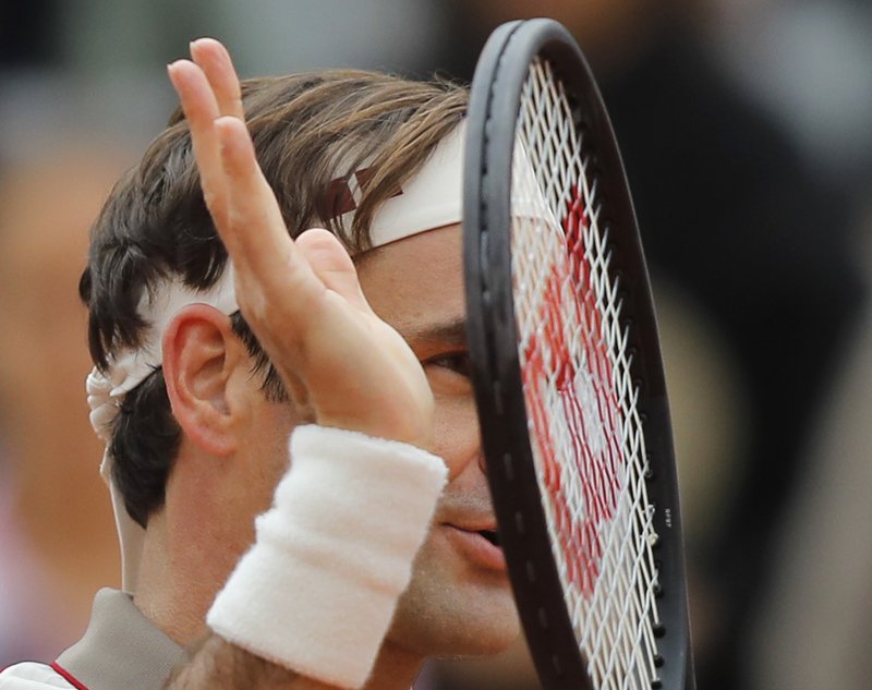 The Associated Press HAPPY RETURN: Switzerland's Roger Federer celebrates winning in three sets 6-2, 6-4, 6-4, against Italy's Lorenzo Sonego during their first round match of the French Open Sunday at the Roland Garros stadium in Paris.