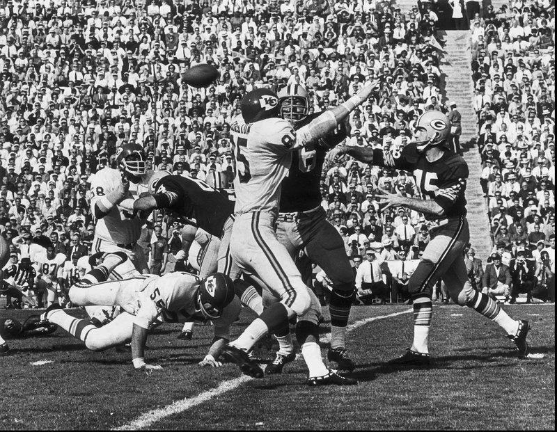 FILE - In this Jan. 16, 1967, file photo, Green Bay Packers quarterback Bart Starr, right, throws a pass during first quarter action during Super Bowl I against the Kansas City Chiefs, at the Los Angeles Coliseum. The Packers beat the Chiefs 35-10. Starr, the Green Bay Packers quarterback and catalyst of Vince Lombardi's powerhouse teams of the 1960s, has died. He was 85. The Packers announced Sunday, May 26, 2019, that Starr had died, citing his family. He had been in failing health since suffering a serious stroke in 2014. (AP Photo/Los Angeles Times)/Los Angeles Times via AP)