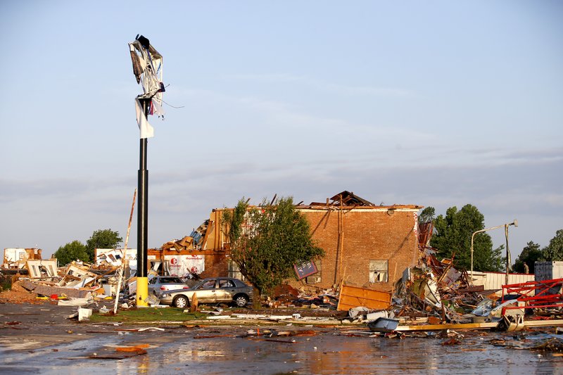 Debris lies on the ground at the American Budget Value Inn after a tornado moved through the area in El Reno, Okla., Sunday, May 26, 2019. The deadly tornado leveled a motel and tore through the mobile home park near Oklahoma City overnight. (Bryan Terry/The Oklahoman via AP)