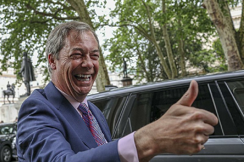 Brexit Party leader Nigel Farage arrives Monday at the party’s headquarters in London before an event to mark the inroads his party made in the European Parliament elections. 