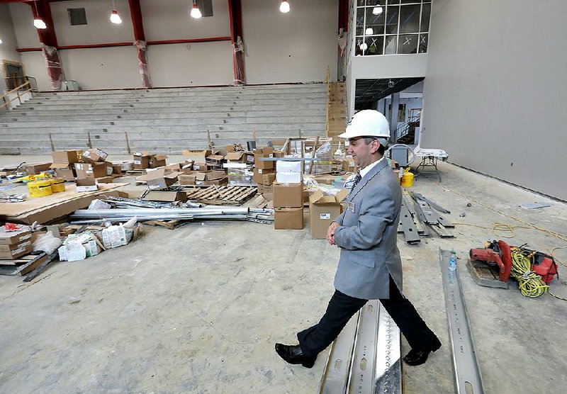 LISA Academy Superintendent Dr. Fatih Bogrek walks through the school’s new gymnasium being built in Sherwood last week. 