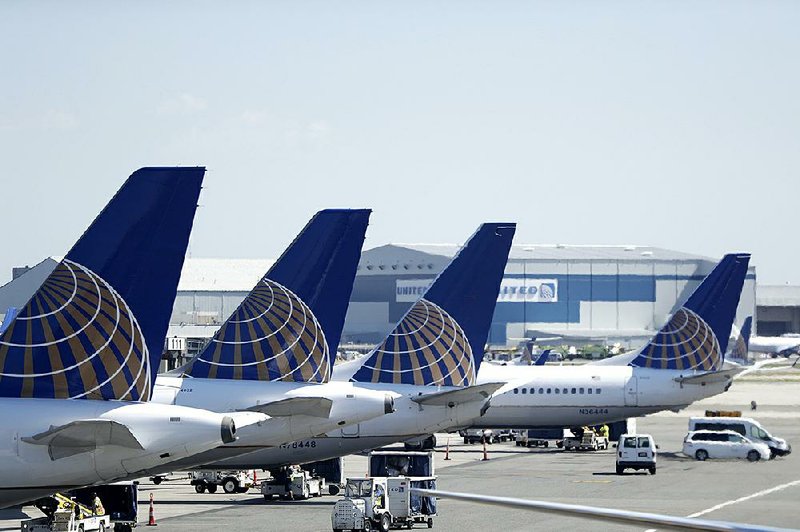 United Airlines jets sit at a gate last July at Newark Liberty International Airport in Newark, N.J. The summer travel season will likely be complicated by the grounding of Boeing 737 Max planes.