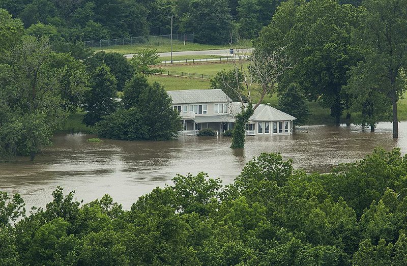 NWA Democrat-Gazette/BEN GOFF @NWABENGOFF
A view of the flooded Arkansas River Tuesday, May 28, 2019, as seen from a residence on Steward Street in Van Buren. 
