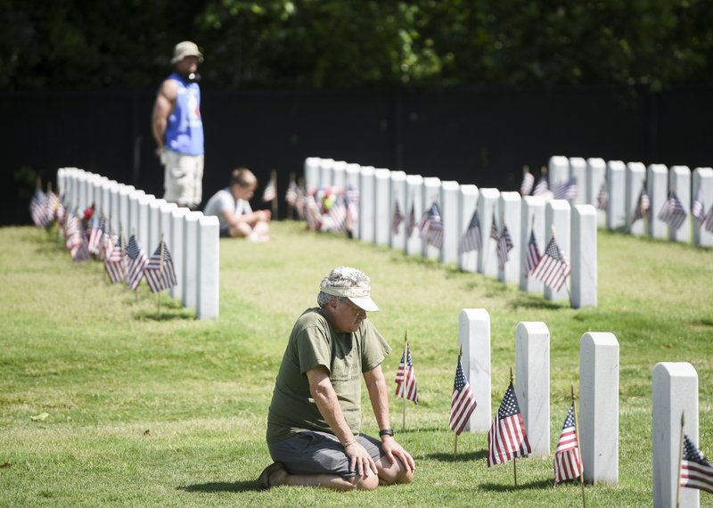 Calvin Yockey of Fayetteville remembers his father, James Yockey, during a Memorial Day ceremony at Fayetteville National Cemetery in this May 2019 file photo. The federal holiday is celebrated on the last Monday of May to honor the men and women who have died while serving in the military.