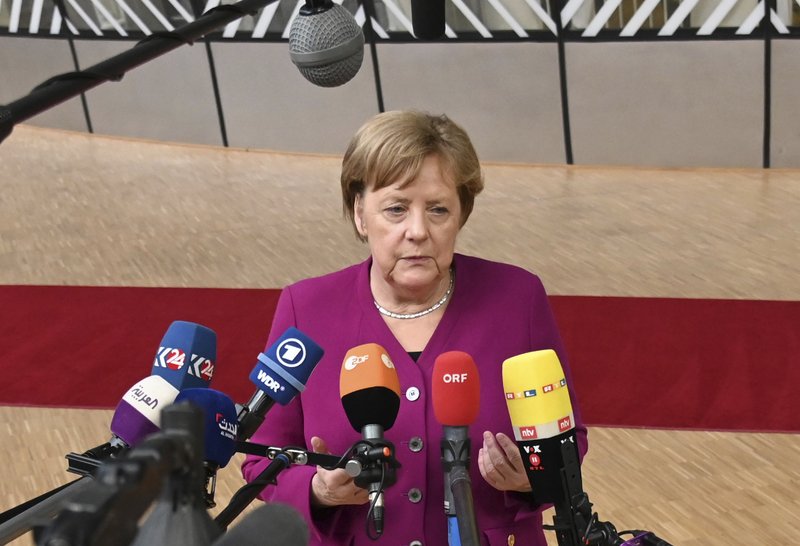German Chancellor Angela Merkel speaks with the media as she arrives for an EU summit at the Europa building in Brussels, Tuesday, May 28, 2019. European Union leaders are meeting in Brussels to haggle over who should lead the 28-nation bloc's key institutions for the next five years after weekend elections shook up Europe's political landscape. (AP Photo/Riccardo Pareggiani)
