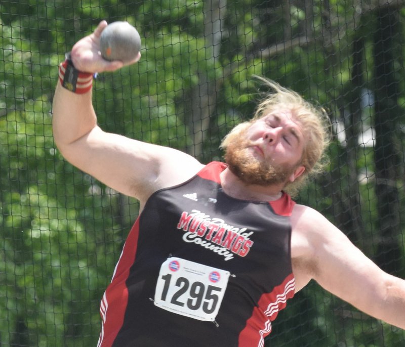 RICK PECK/SPECIAL TO MCDONALD COUNTY PRESS McDonald County's Elliott Wolfe uncorks a throw of 50-1 in the shot put to take fifth place at the Missouri Class 4 State Track and Field Championships held May 25 at Washington High School.