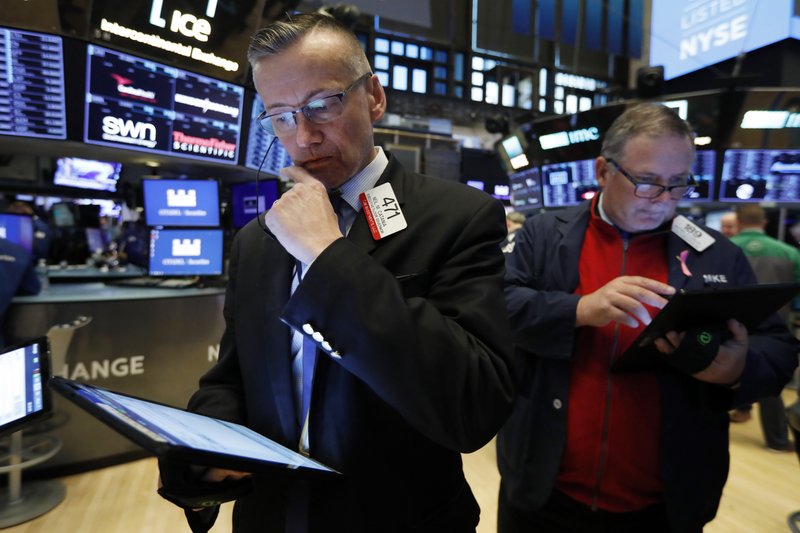 Traders Neil Catania, left, and Michael Conlon work on the floor of the New York Stock Exchange, Wednesday, May 29, 2019. Stocks are getting off to a weak start on Wall Street led by drops in technology and health care companies. (AP Photo/Richard Drew)