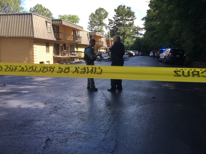 Police investigate the scene of a Thursday shooting at Vantage Point Apartments in Little Rock.
