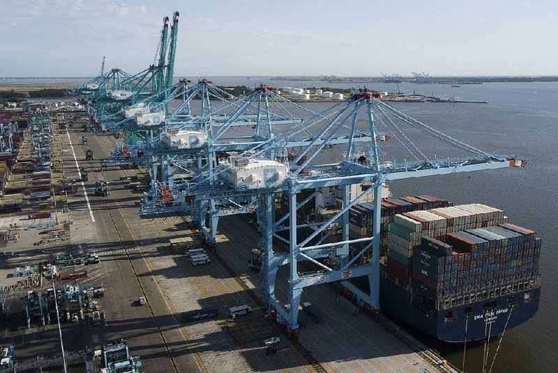 A container ship is unloaded earlier this month at the Virginia International Gateway terminal in Norfolk. The U.S. gross domestic product increased at a 3.1% annualized rate in the first quarter, the Commerce Department reported Thursday. 