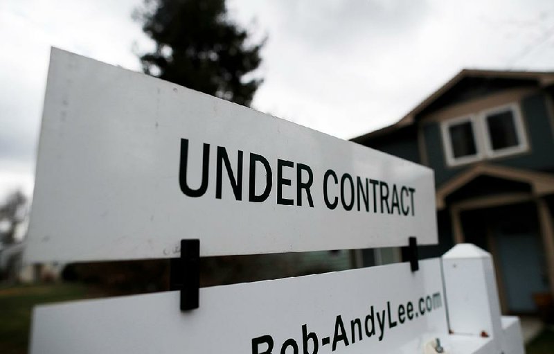 A sign shows a sale pending in March on a single-family home in Denver.