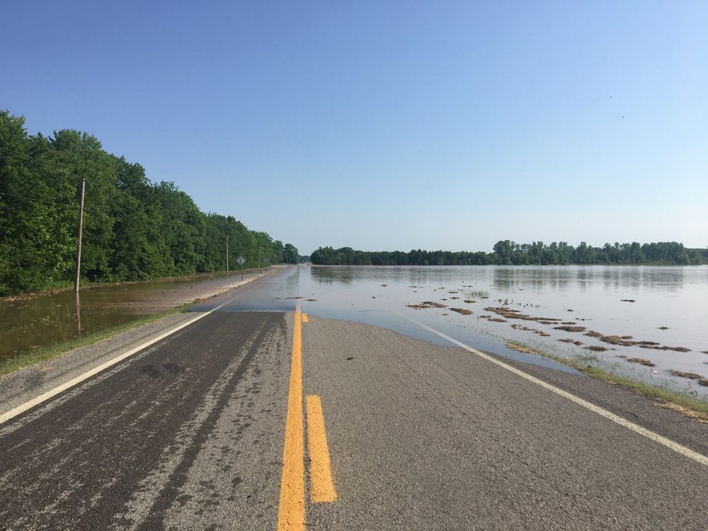 Arkansas 155 is covered by water near Holla Bend after a levee broke nearby early Friday.