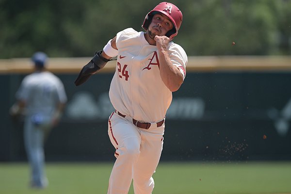 Arkansas center fielder Dominic Fletcher runs to third base on his way to the plate Friday, May 31, 2019, after a double by right fielder Heston Kjerstad during the fifth inning of the Razorbacks' 11-5 win over Central Connecticut at Baum-Walker Stadium in Fayetteville.