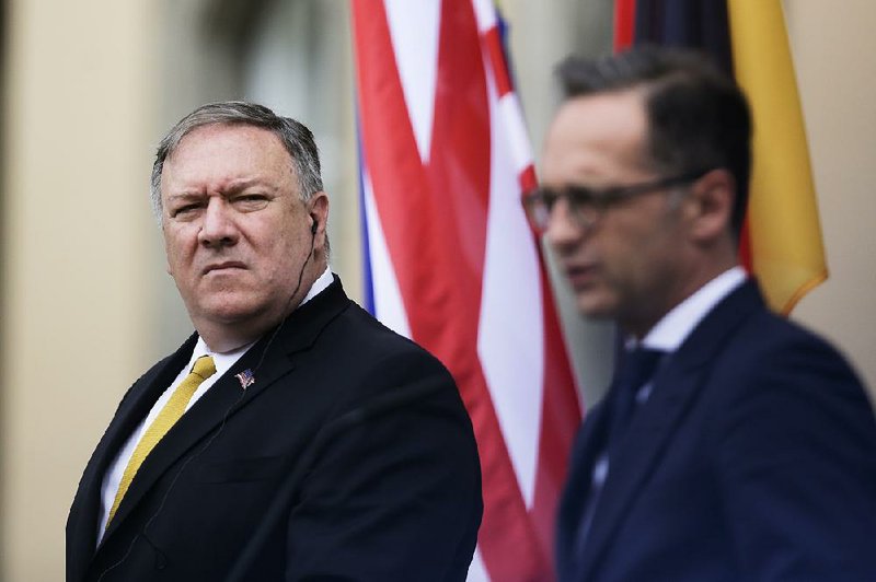 U.S. Secretary of State Mike Pompeo (left) and German Foreign Minister Heiko Maas review their talks on Iranian sanctions Friday at the foreign ministry’s guest house in Berlin. 