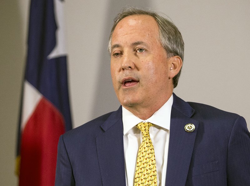 In this May 1, 2018, file photo, Texas Attorney General Ken Paxton speaks at a news conference in Austin, Texas. Computer files discovered in the home of Tom Hofeller, a Republican operative who died last year, contain a blueprint for how the GOP could extend its domination of legislatures in states where growing Latino populations favor Democrats and offer compelling context about a related case currently before the U.S. Supreme Court. Many of the state's top Republicans, including Paxton, have publicly expressed support for a citizenship question on the Census. (Nick Wagner/Austin American-Statesman via AP, File,)