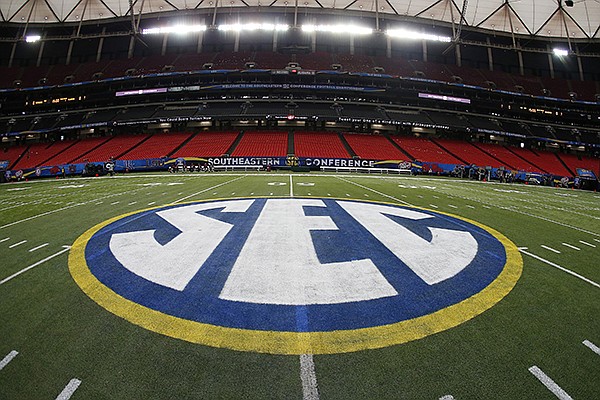 In this Dec. 5, 2014, file photo, SEC logo is displayed on the field ahead of the Southeastern Conference championship football game between Alabama and Missouri in Atlanta. (AP Photo/John Bazemore, File)