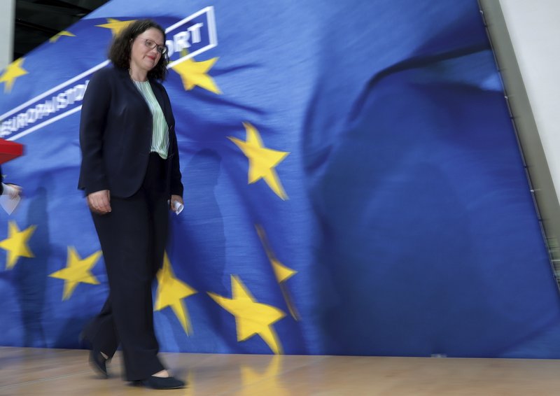 FILE -- In this Monday, May 27, 2019 photo taken with a long time expsure Andrea Nahles, chairwomen of the German Social Democratic Party (SPD), leaves after a press conference following a party's board meeting in Berlin, Germany. (AP Photo/Michael Sohn, file)