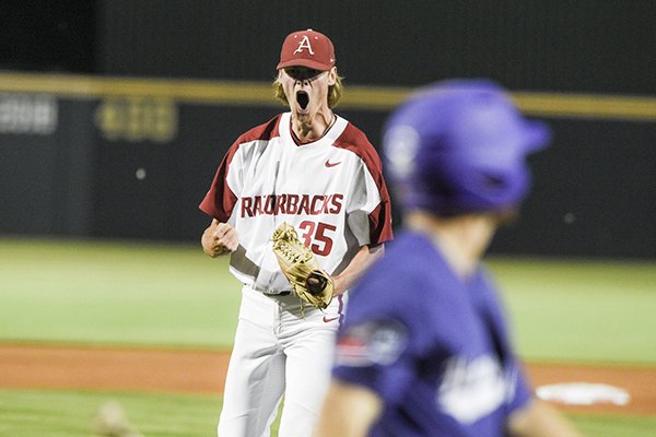 Arkansas pitcher Jacob Kostyshock reacts after recording the final out of an NCAA regional game against TCU on Sunday, June 2, 2019, in Fayetteville. 