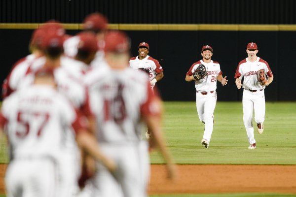 Arkansas Razorbacks players react after a 6-0 victory against Texas Christian University during the NCAA Division I Baseball Championship Regionals, Sunday, June 2, 2019 at Baum-Walker Stadium in Fayetteville.