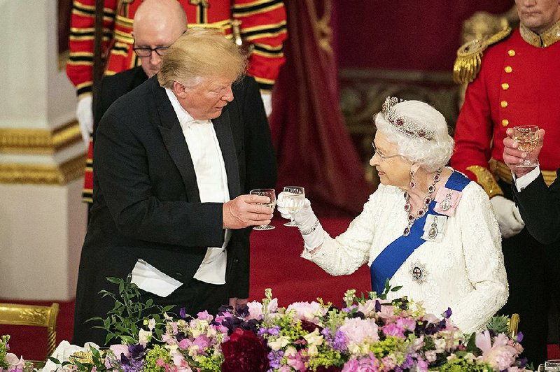 President Donald Trump and Queen Elizabeth II make a toast during Monday’s state banquet at Buckingham Palace in London. 