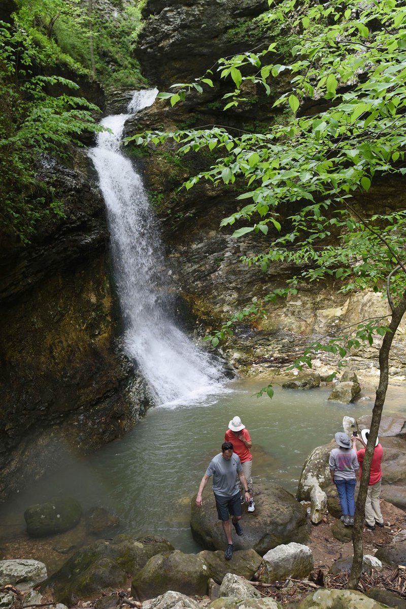 NWA Democrat-Gazette/FLIP PUTTHOFF Hikers visit Eden Falls at Lost Valley on May 3 2019. The waterfall is at the end of a 1.1-mile trail through Lost Valley near the Buffalo National River west of Ponca. Lost Valley reopened in May after being closed for improvements to the entrance and along the trail.