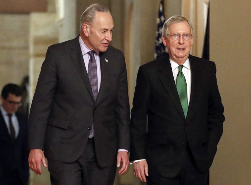 FILE - In this Feb. 7, 2018, file photo, Senate Majority Leader Mitch McConnell, R-Ky., and Senate Minority Leader Chuck Schumer, D-N.Y., left, walk to the chamber the Capitol in Washington. Some of the old timers in the Senate are getting fed up with the drought of legislation. But after weeks of focus on approving President Trump&#x2019;s backlog of nominees, there&#x2019;s a chance the chamber will soon be stretching its legs again. (AP Photo/Pablo Martinez Monsivais, File)