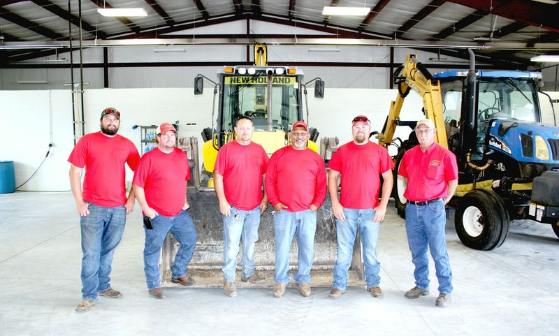 MARK HUMPHREY ENTERPRISE-LEADER City public works employees (from left): Tyrell Murphy, Travis Carlin, Brian Clevenger, Isaac Navarro, and Tanner Denham; along with Floyd Shelley, public works manager; are excited to work out of a new Public Works facility large enough to keep tractors and equipment inside out of the elements. An open house allowed the public to tour the facility Friday afternoon.