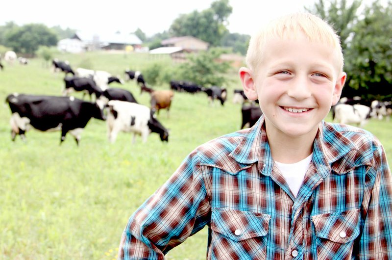 FILE PHOTO Levi Weaver, 10 years old in this photo, tells about living on a dairy farm and being active in 4H during media day for the 2015 Washington County Farm Family of the Year.