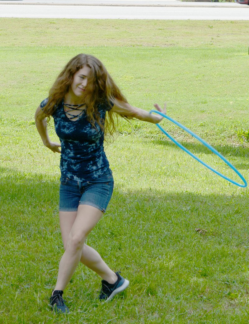 Keith Bryant/The Weekly Vista Ashley Cooper manuevers her hula hoop.