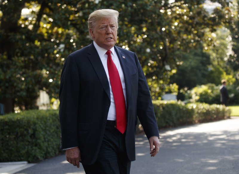 In this Thursday, May 30, 2019, file photo, President Donald Trump talks with reporters before departing on Marine One, in Washington. The majority owner of a former Trump-branded hotel in Panama alleged in a court filing on Monday, June 3, 2019, that the U.S. president's company misrepresented finances of the building to evade taxes in the country. (AP Photo/Evan Vucci, File)