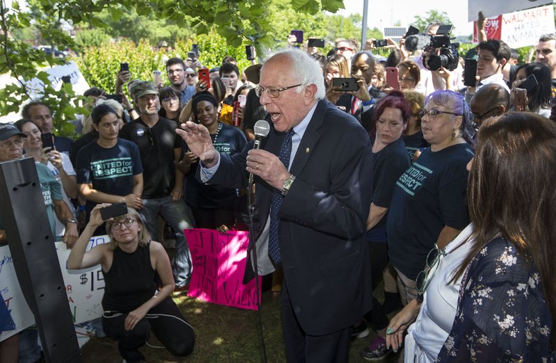 U.S. Sen. Bernie Sanders (I-Vt.) speaks to a crowd of his supporters gathered Wednesday, June 5, 2019, outside the Walmart shareholders formal business meeting at the John Q. Hammons Center in Rogers. 