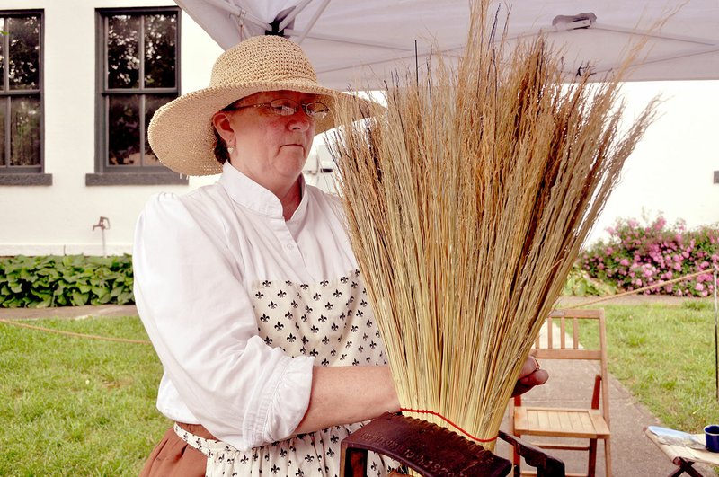 RACHEL DICKERSON/MCDONALD COUNTY PRESS June Freund of Granby demonstrates making brooms at the McDonald County Museum during &quot;History Live&quot; on Saturday, May 25.