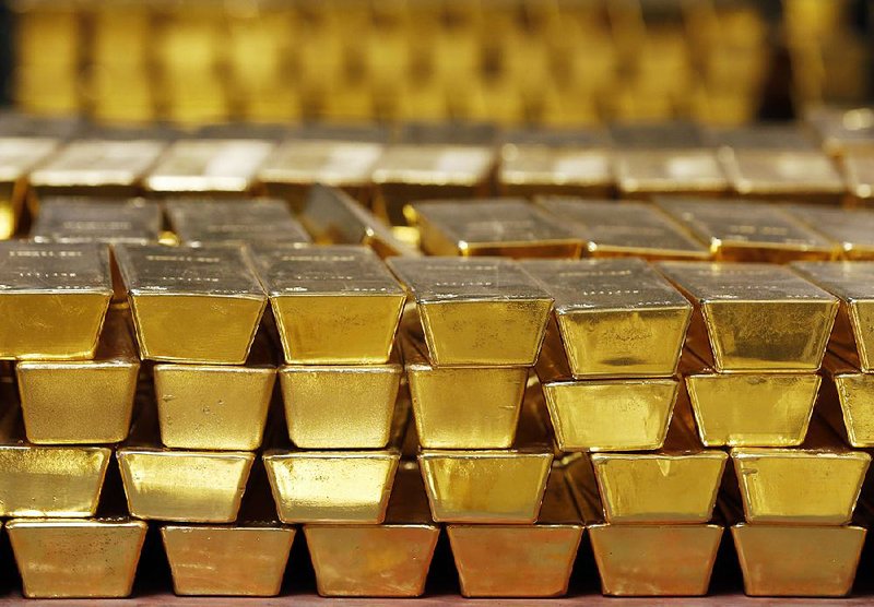 Gold bars sit stacked in a vault at the U.S. Mint in West Point, N.Y., in this 2014 photo. 