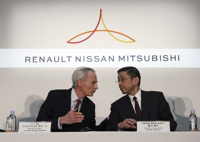 Renault Chairman Jean-Dominique Senard (left) and Nissan Chief Executive Officer Hiroto Saikawa talk before a joint news conference in March at Nissan headquarters in Yokohama, Japan.