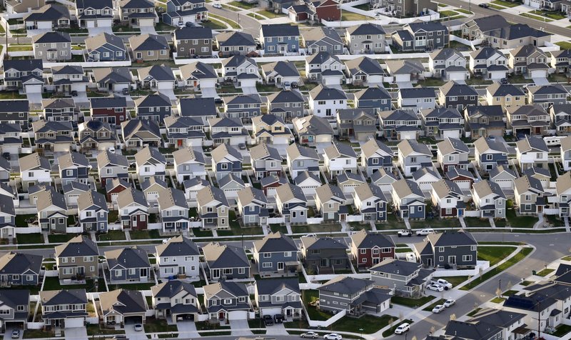 This April 13, 2019, file photo, shows rows of homes, in suburban Salt Lake City.  (AP Photo/Rick Bowmer, File)