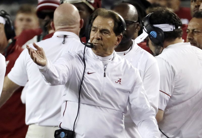 In this Jan. 7, 2019, file photo, Alabama coach Nick Saban reacts during the first half the team's NCAA college football playoff championship game against Clemson in Santa Clara, Calif. A former college football player from Ohio now living in Germany is trying to open a pipeline to the United States for European recruits. (AP Photo/Chris Carlson, File)