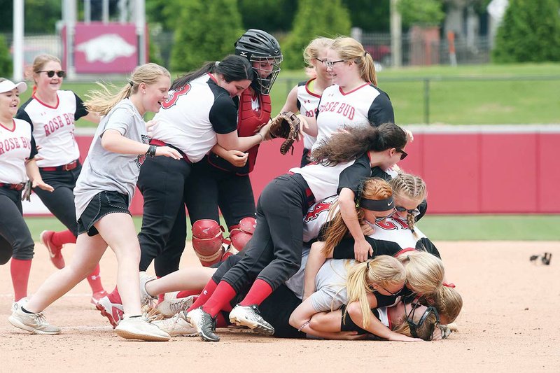 The Rose Bud softball team celebrates a 7-3 win over Genoa Central on May 20 during the Class 3A state softball championship game at Bogle Park at the University of Arkansas at Fayetteville.