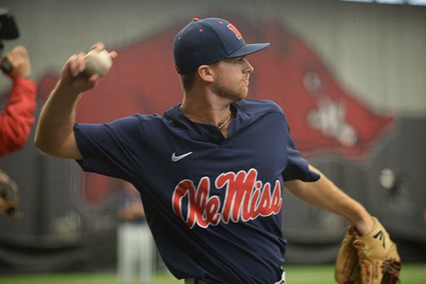 Ole Miss shortstop Jacob Adams throws during practice Friday, June 7, 2019, in Fayetteville. Adams, of Conway, and Ole Miss will meet Arkansas in the first game of the NCAA Fayetteville Super Regional on Saturday. 