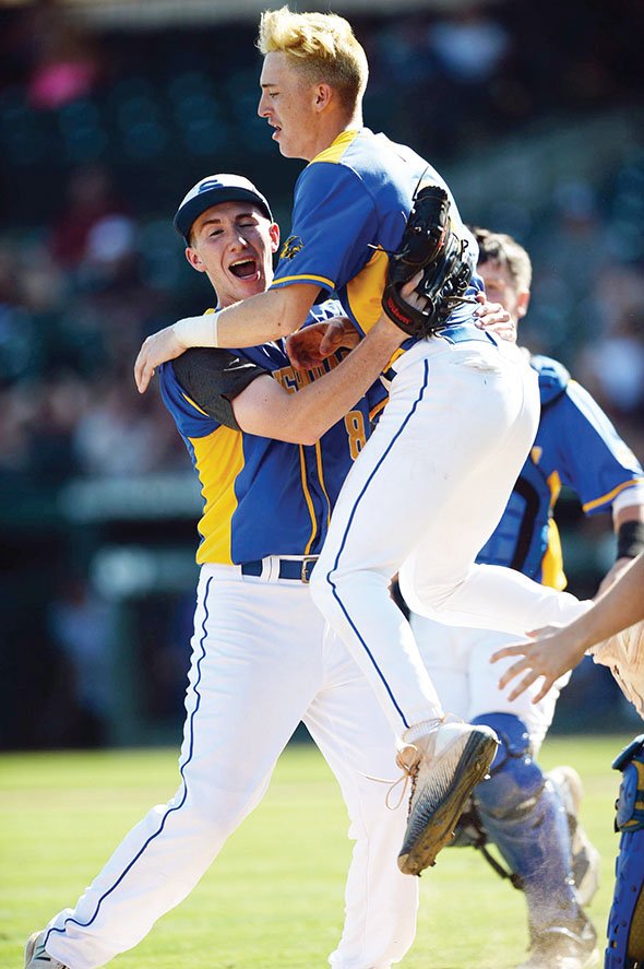 Sheridan relief pitcher Brandon Arledge, left, and shortstop Brayden Sites celebrate after the final out of the Yellowjackets’ 2-0 win over Benton in the Class 5A state-championship game May 17 at Baum-Walker Stadium in Fayetteville.