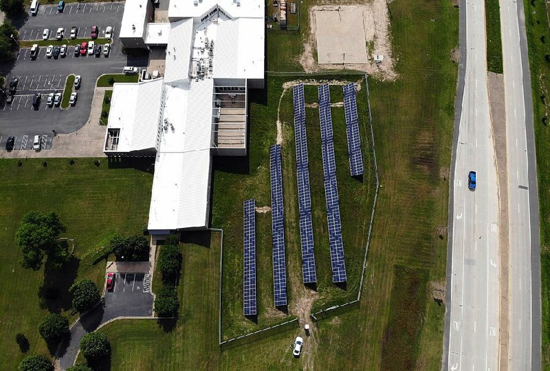 Solar panels built by North Little Rock-based Seal Solar to power Jefferson County government facilities are set up on grounds outside the youth lockup. 