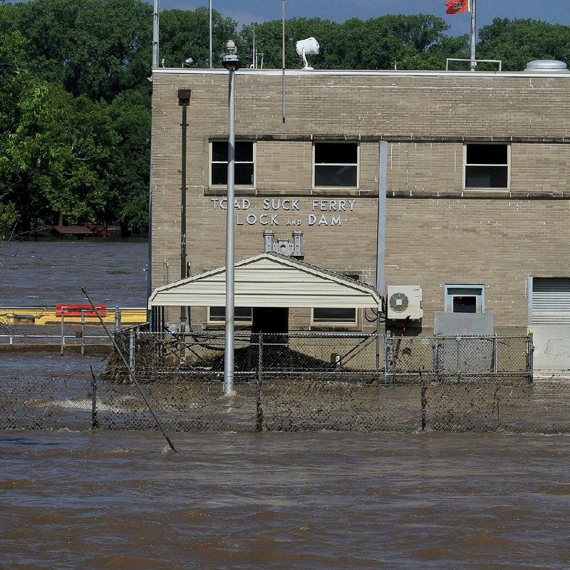 The water was still high Saturday around the Toad Suck Ferry Lock and Dam. In neighboring Faulkner County, officials breathed a sigh of relief over the condition of the levee at Lollie Bottoms.