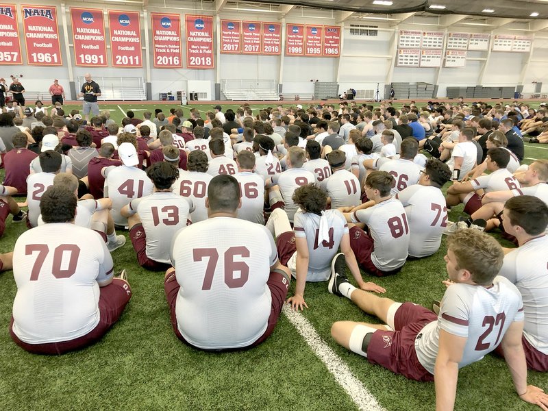 Photo submitted The Siloam Springs football team, along with 10 other teams from Arkansas, Missouri, Oklahoma and Kansas, listen to instructions from the Pittsburg (Kan.) State football coaches during the university's team camp on June 2. The Panthers competed in the camp on June 2-3.