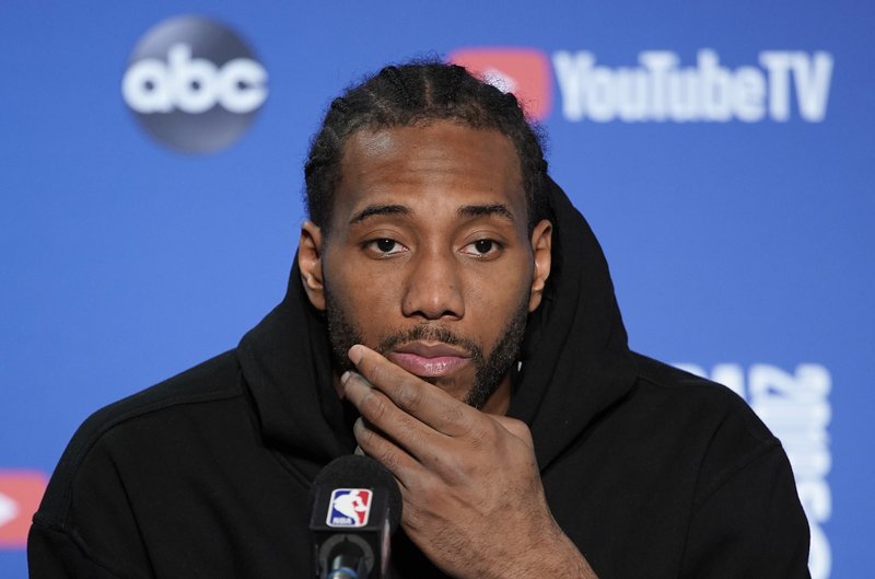 Toronto Raptors forward Kawhi Leonard speaks at a news conference after Game 4 of basketball's NBA Finals against the Golden State Warriors in Oakland, Calif., Friday, June 7, 2019. (AP Photo/Tony Avelar)