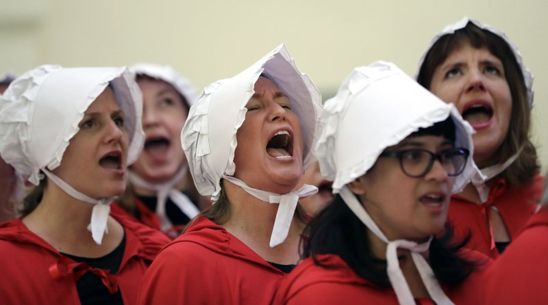  In this Tuesday, May 23, 2017 file photo, activists dressed as characters from "The Handmaid's Tale", chant in the Texas Capitol Rotunda as they protest SB8, a bill that would require health care facilities, including hospitals and abortion clinics, to bury or cremate any fetal remains whether from abortion, miscarriage or stillbirth, and they would be banned from donating aborted fetal tissue to medical researchers in Austin. Tissue left over from elective abortions has been used in scientific research for decades, and is credited with leading to lifesaving vaccines and other advances. (AP Photo/Eric Gay)