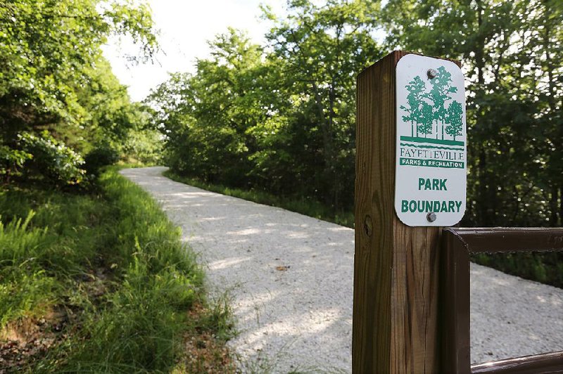 A boundary gate marks the end of Centennial Park Lane on the southwest side of Millsap Mountain in Fayetteville. The City Council has approved a conceptual plan to build the park. 