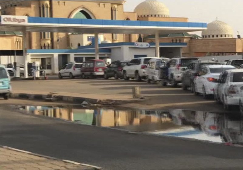 In this frame grab from video, people wait in line for gasoline, in Khartoum, Sudan, Sunday, June 9, 2019. The first day of the workweek in Sudan saw shops closed and streets empty as part of a general strike called by protest leaders who are demanding the resignation of the ruling military council. The Sudanese Professionals Association had urged people to stay home to protest a deadly crackdown last week, when security forces violently dispersed the group&#x2019;s main sit-in camp outside the military headquarters in the capital of Khartoum. (AP Photo)